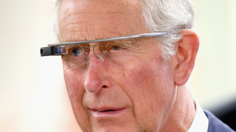Prince Charles wearing a Google Glass headset during a demonstration.