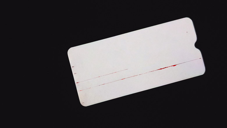 An Android phone display suffering from a hardware-related vertical line glitch.