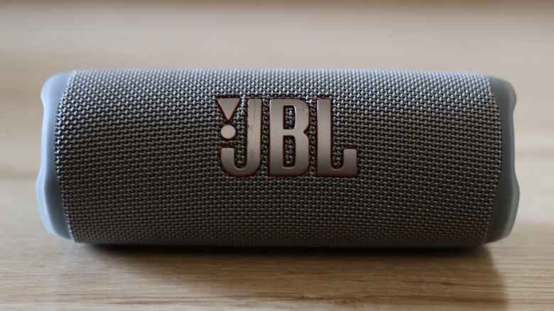 A close-up view of a JBL portable speaker's mesh exterior and rugged design.