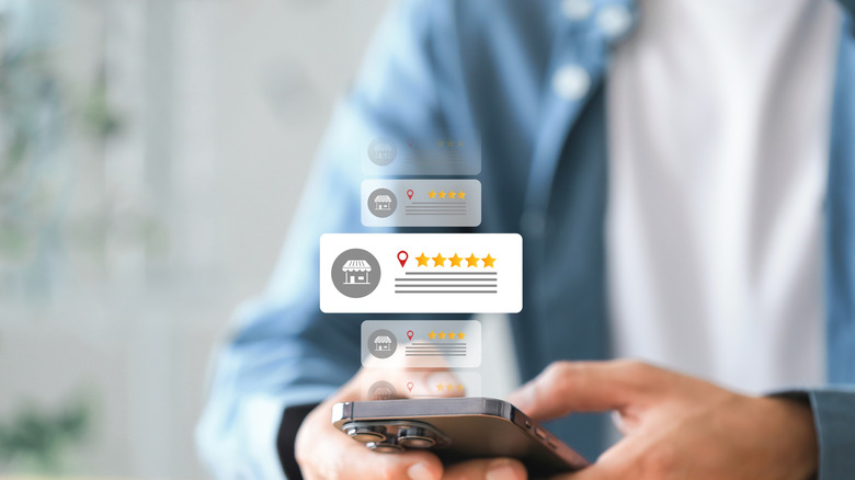 Holographic five-star rating icons floating above a smartphone screen.