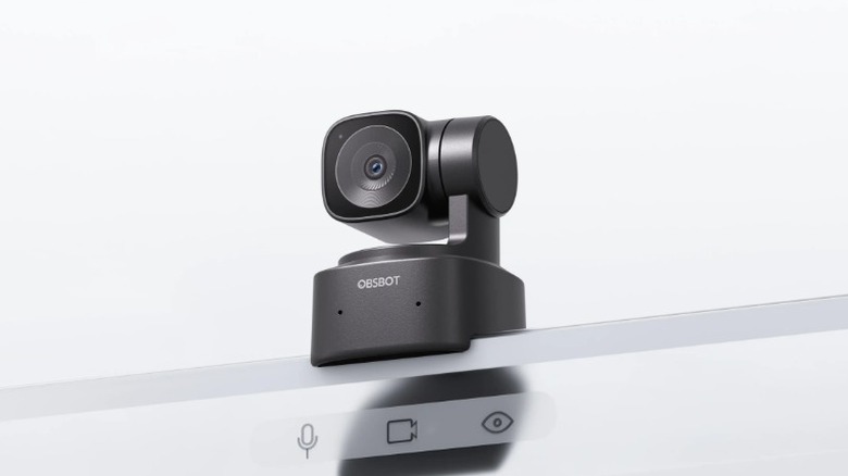 The Obsbot Tiny SE webcam clipped to the top of a computer screen.