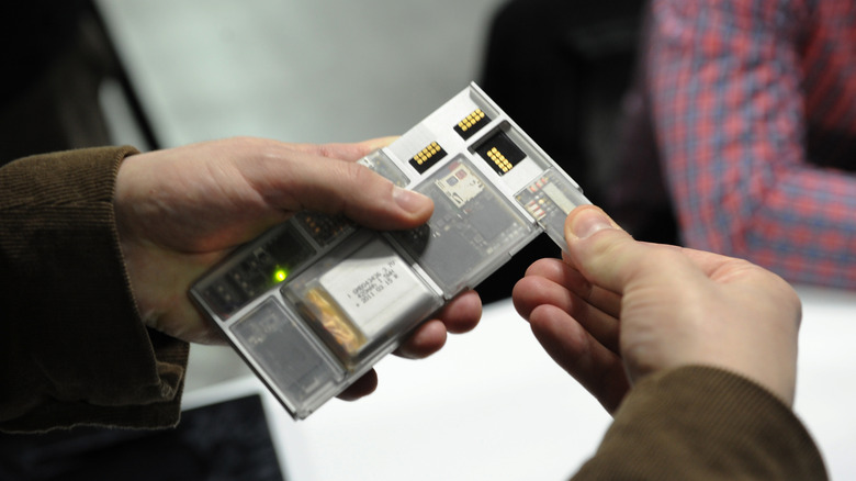 A close-up of the Project Ara modular phone showing individual component blocks.