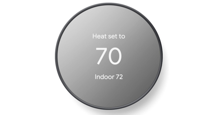 The standard Google Nest Thermostat with its vibrant display and modern circular design.