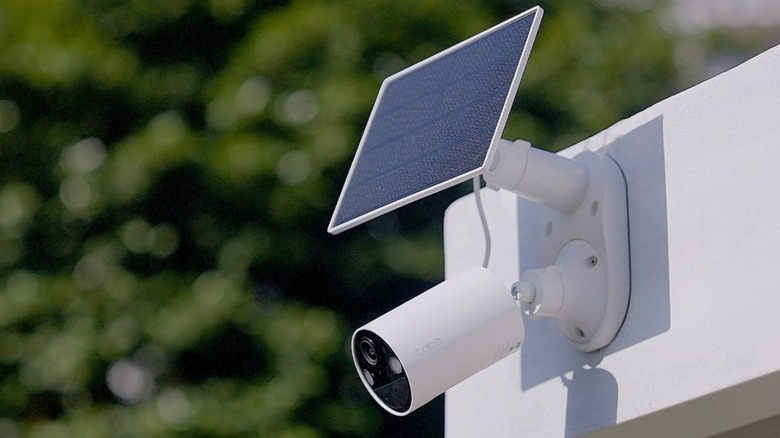 An outdoor security camera from the TP-Link Tapo solar-powered kit mounted on a wall.