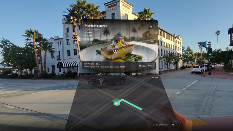 First-person view through AR glasses showing digital navigation tiles and restaurant info layered over a street scene.