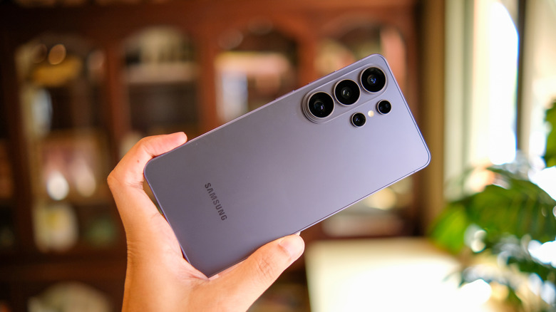 A person holding the Samsung Galaxy S26 Ultra showing its rear camera array.