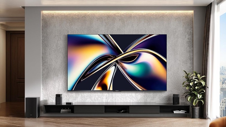 The Hisense U8QG TV set up in a living room.