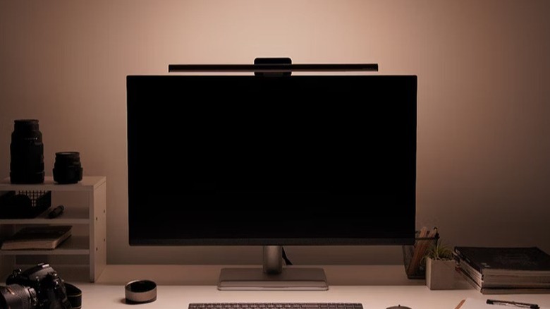 The BenQ ScreenBar Halo 2 mounted on top of a desktop monitor.
