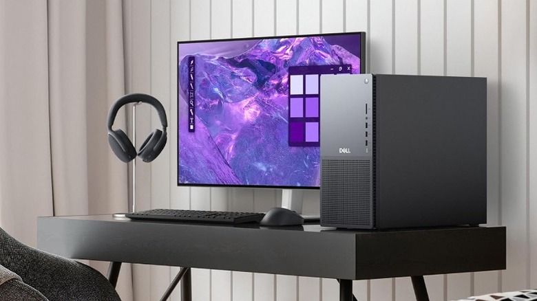 A professional Dell tower desktop setup on a workspace desk.