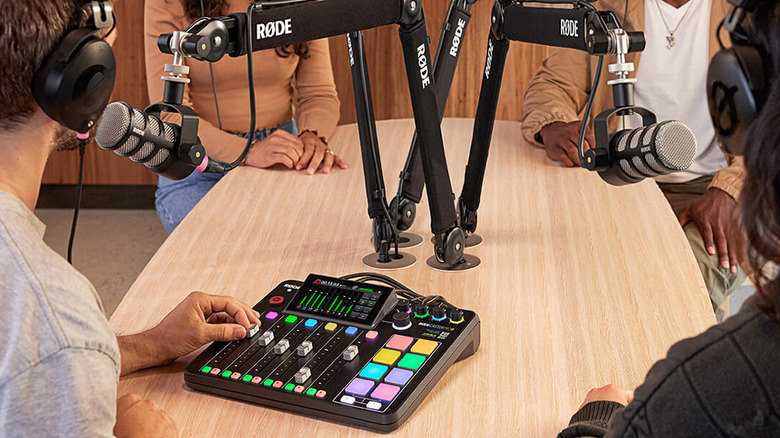 The RØDECaster Pro II being used in a studio for a four-person podcast recording session.