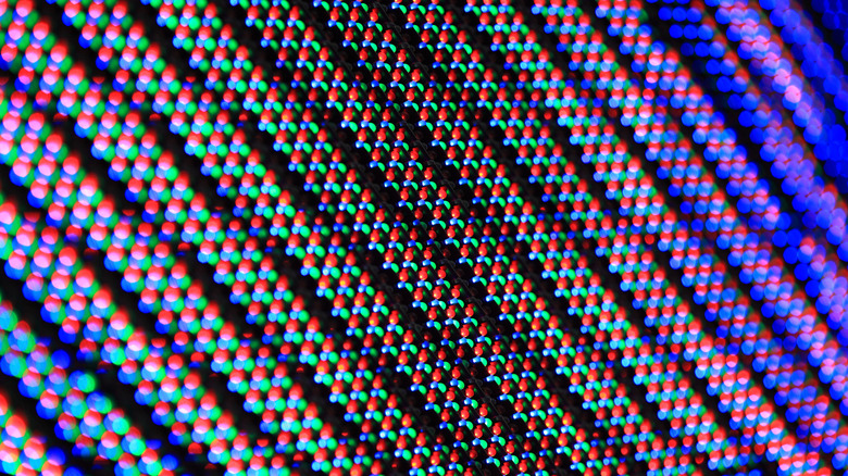 Extreme close-up macro shot of the individual pixel grid on an LED monitor panel.