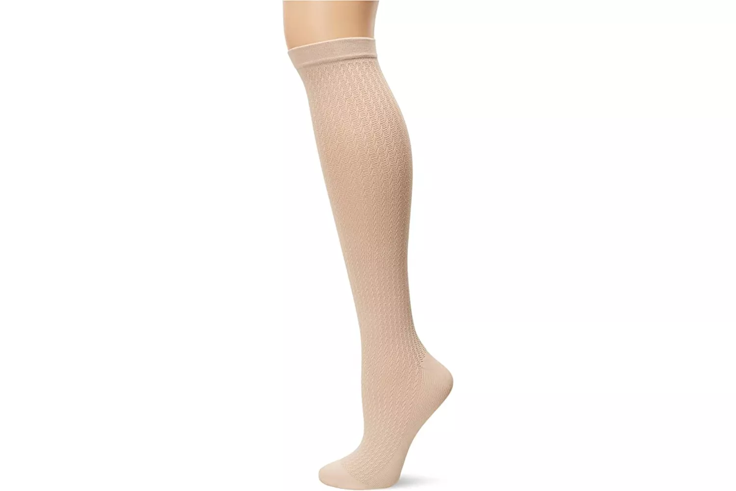 A close-up of a beige textured compression sock on a mannequin leg.